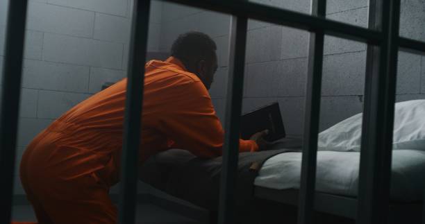 istock Religious African American prisoner prays to God 1608538393