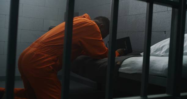 Religious African American prisoner prays to God