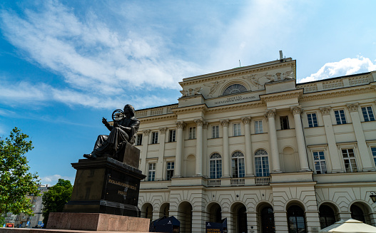 Vienna, Austria - April 9, 2012: Sculpture in front of Albertina museum in Vienna. It was part of Hofburg imperial palace and now it houses one of the largest and most important print rooms in the world. It is located in central Vienna. On this photo is terrace of museum where many people rest and look at the opera across the street.