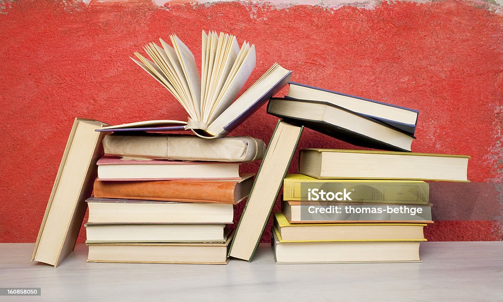 book arrangement, one opened Backgrounds Stock Photo