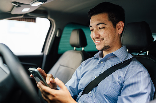 App driver using smartphone in car