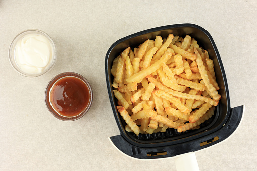 Top View Cooking Potato French Fries using Airfryer Machine, Cooking with No Oil.