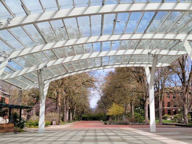 Graceful Arch A large white arch shades a concrete square oregon state university stock pictures, royalty-free photos & images