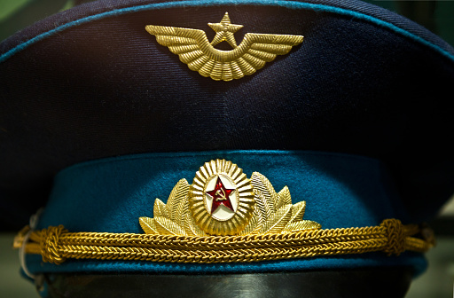 A close up of the insignia on a soviet era military officers cap