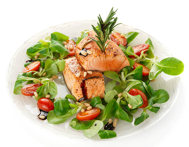istock Rare fried salmon steaks isolated on white 160860480