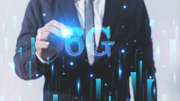 istock Businessman hand drawing 6G network hologram on white background. Technology and communication concept. Double exposure 1608619434