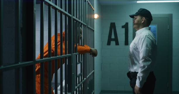 istock Warden comes to jail cell and screams on prisoner 1608633168
