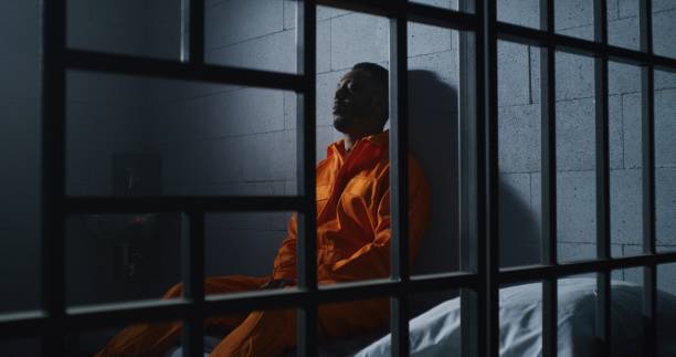 istock Guilty prisoner sits and thinks about freedom 1608637526
