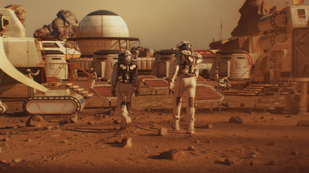 istock Two astronauts walk toward research station on Mars 1608681003