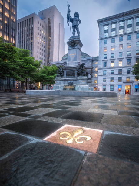 Historic Place D'Armes Square in Old Montreal Place D'Armes Square in historic Old Montreal featuring a statue of Paul Chomedey de Maisonneuve,  one of Montreal's most prominent founders. place darmes montreal stock pictures, royalty-free photos & images