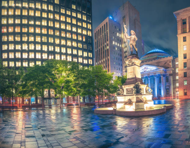 Historic Place D'Armes Square in Old Montreal Place D'Armes Square in historic Old Montreal featuring a statue of Paul Chomedey de Maisonneuve,  one of Montreal's most prominent founders. place darmes montreal stock pictures, royalty-free photos & images