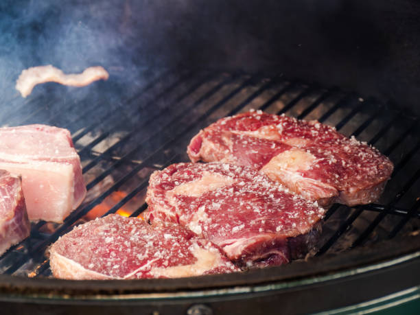 istock Classic Delicious Beef Steaks on the Grate Over Charcoal Grill 1608726206