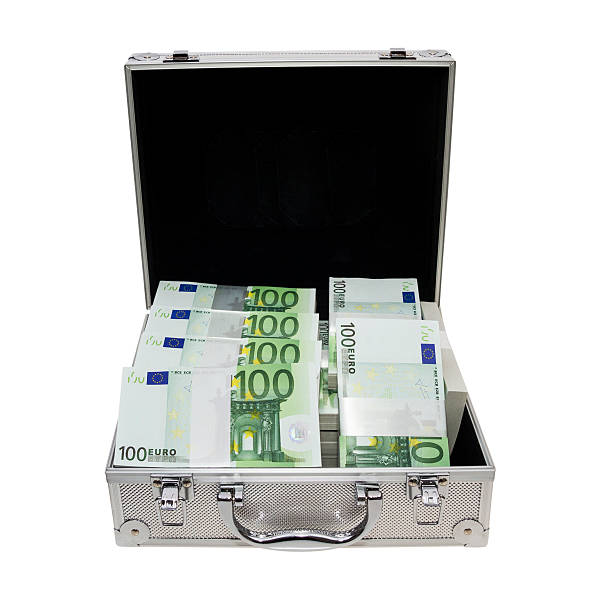 aluminium suitcase full of Euro notes bundles stock photo
