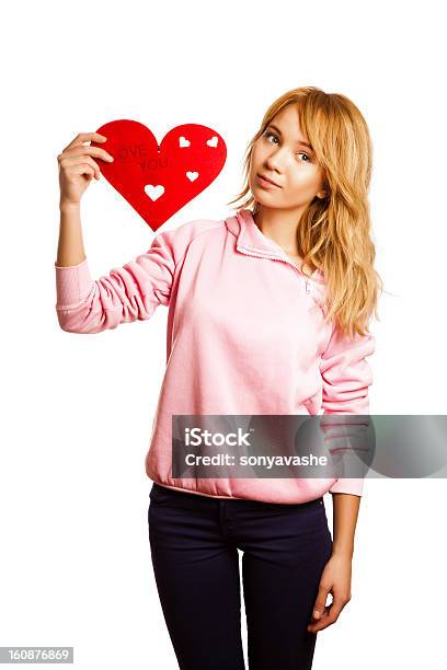 Rubia Girle Sostiene Rojo En Forma De Corazón Foto de stock y más banco de imágenes de Adolescente - Adolescente, Adulto, Adulto joven