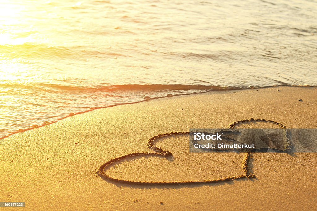 Hearts drawn on the sand of a beach Beach Stock Photo