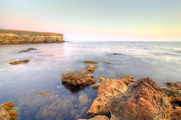 istock Sea landscape with orange stones 160880457