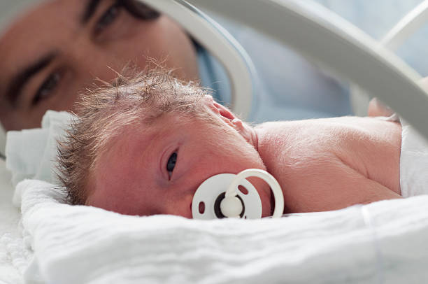 Newborn baby in incubator