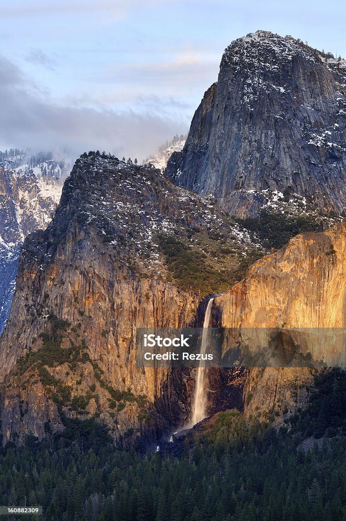 Bridalveil Falls litted by evening sun in Yosemity National Park Mountain landscape with Bridalveil Falls litted by evening sun in Yosemity National Park Falling Stock Photo
