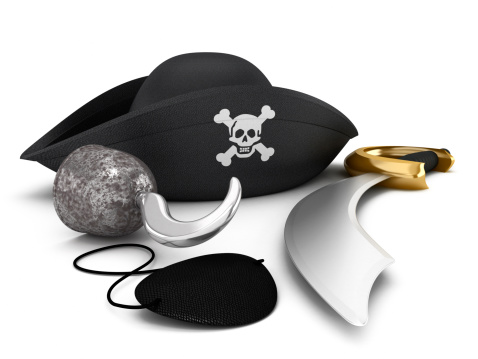 Pirate hat, hook, eyepatch and sword isolated on white.