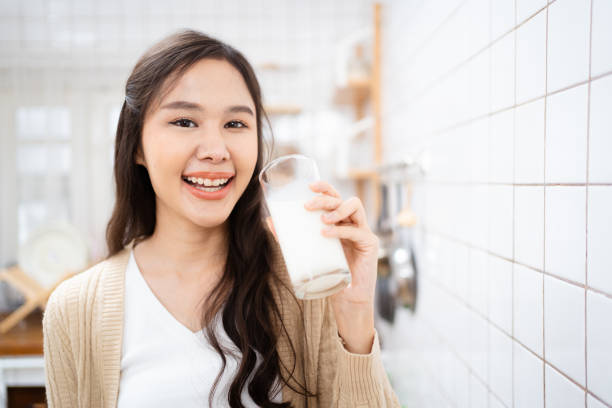 istock Woman drinking a milk 1608828469
