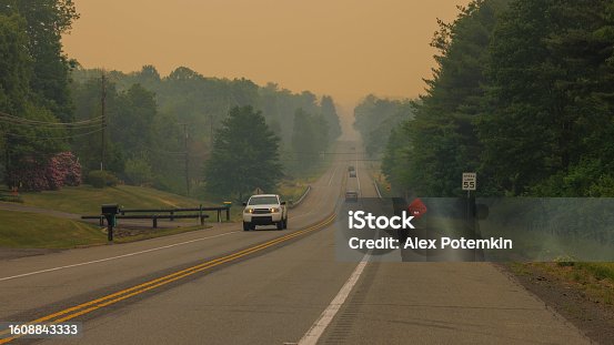 istock Road vanishing in smoky distance: highway road disappears into smog. Rural area of Jim Thorpe in the Appalachian Mountains, Poconos, Pennsylvania 1608843333