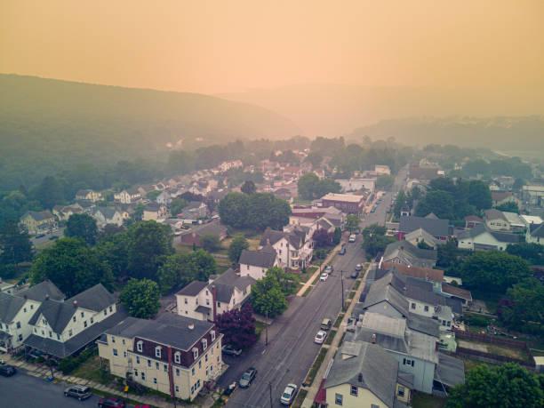 istock Climate change aftermath in small community under smog. Road to nowwhere under the mist in Jim Thorpe, Appalachian Mountains, Poconos, PA. Aerial view at sunset 1608843801