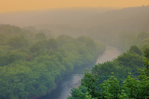 Smog from Canadian fires covers Lehigh river crossing green value. Mountain landscape in Jim Thorpe (Mauch Chunk) of Appalachian Mountains, Poconos, Pennsylvania
