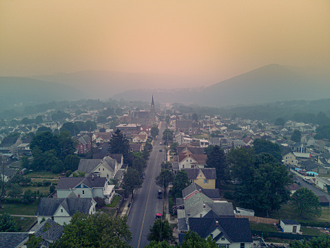 Wildfires smog above Jim Thorpe neighborhood (Mauch Chunk) of Appalachian Mountains, Poconos, Pennsylvania. Drone aerial view of cityscape
