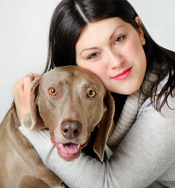 istock Young woman with dog 160885401