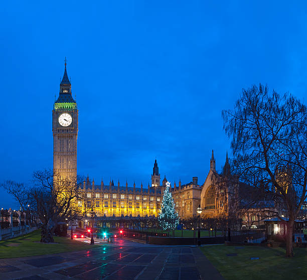 istock Big Ben in London with Christmas tree at dusk 160885717