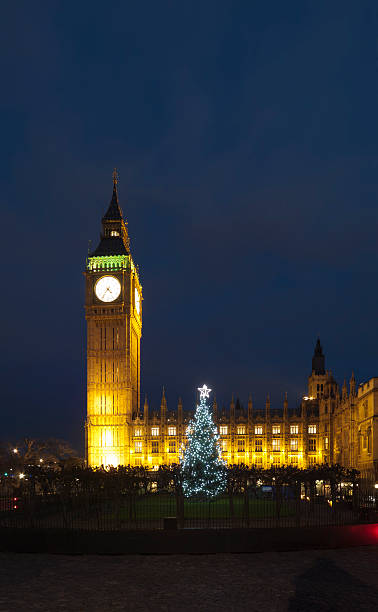 istock Big Ben in London with Christmas tree at dusk 160885720