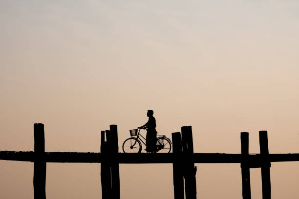 Sunset over a wooden dock at Inle Lake, Myanmar.