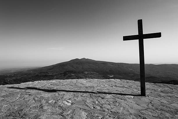 istock Black cross with mountain in background 160887785
