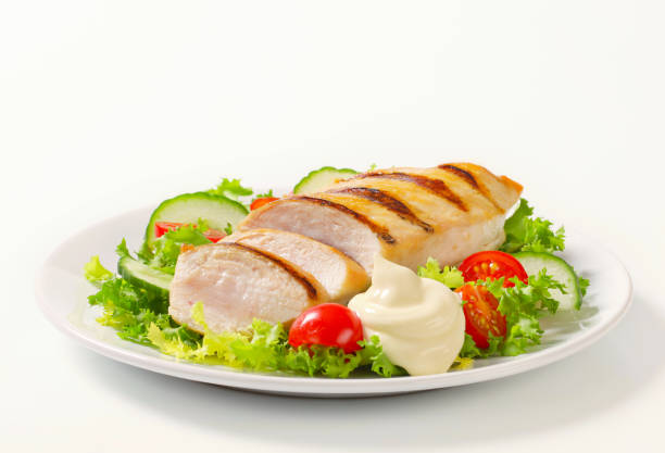 istock grilled chicken breast with vegetable garnish 160887972