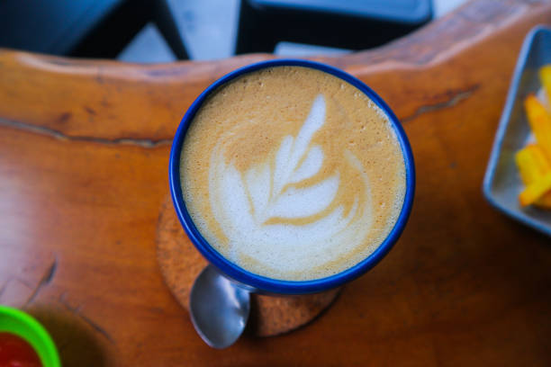 istock A cup of latte coffee on wooden table 1608893508