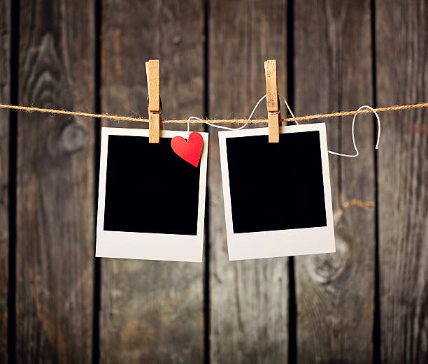 istock Blank photos with red heart hanging on clothesline. 160889927