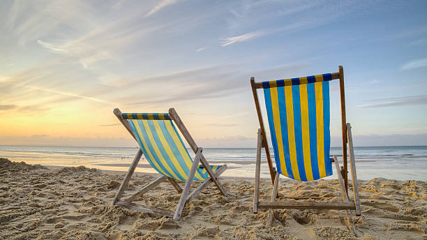 Two Deckchairs On A Beach stock photo