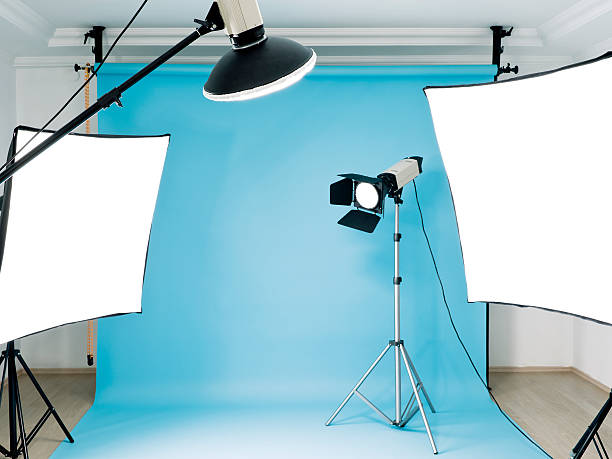 Empty photographic studio Empty photographic studio ready for shoot with blue background photo shoot stock pictures, royalty-free photos & images