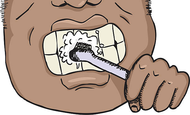 Man Brushing Teeth Close up of African man brushing teeth over isolated background. Download includes high resolution JPG with layered EPS. black man brushing teeth stock illustrations