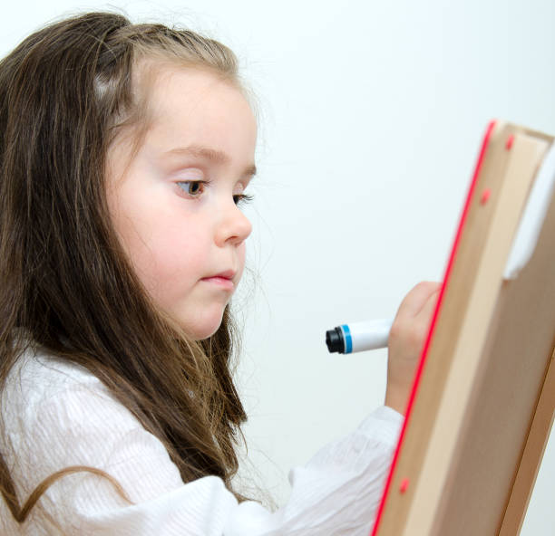 istock Cute little girl drawing on board 160890951