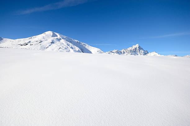 istock Candid slope and snowcapped mountains 160892361