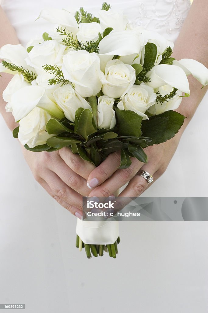 Classic bridal bouquet Classic white roses and lilies in bridal bouquet Adult Stock Photo