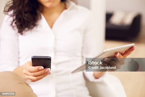 Modern Woman With A Smartphone And Tablet Stock Photo - Download Image Now - Adult, Adults Only, Communication