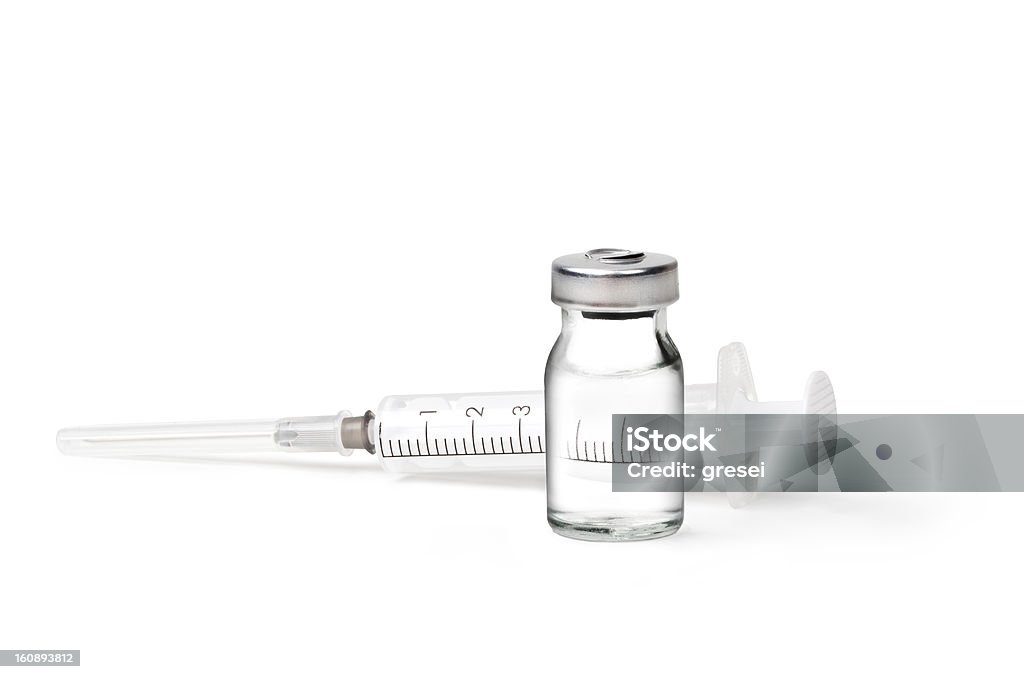 A medical ampoules and syringe lay down medical ampoules and syringe isolated on white background Syringe Stock Photo