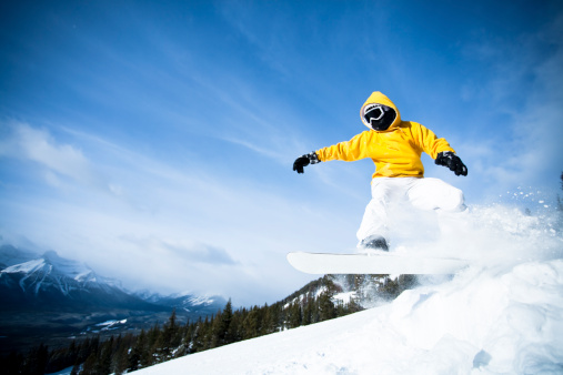 Male snowboarder in the mountain