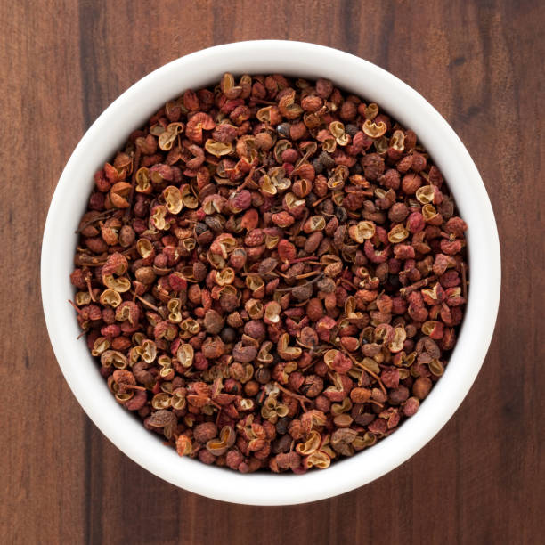 Szechuan peppercorns Top view of white bowl full of szechuan peppercorns sichuan province stock pictures, royalty-free photos & images