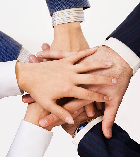 istock Close-up of hands together representing teamwork 160895648