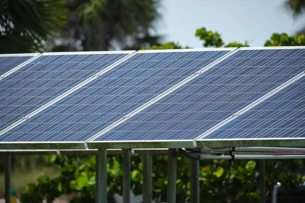 istock Solar panels installed on stand frame near parking lot for effective generation of clean electricity. Photovoltaic technology integrated in urban infrastructure for electric car charging 1608961555