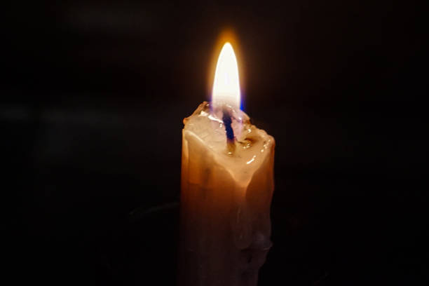 istock A candle that burns in the darkness. 1608984635