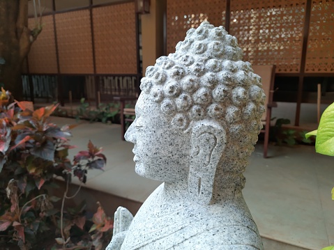 A buddha statue in a park for decoration